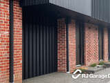Tilt Garage Door with vertically clad Nailstrip Colorbond Matte Black