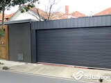 Fenceline Australian Roller Garage Door - Colorbond Colour 'Ironstone' with Square Canopy